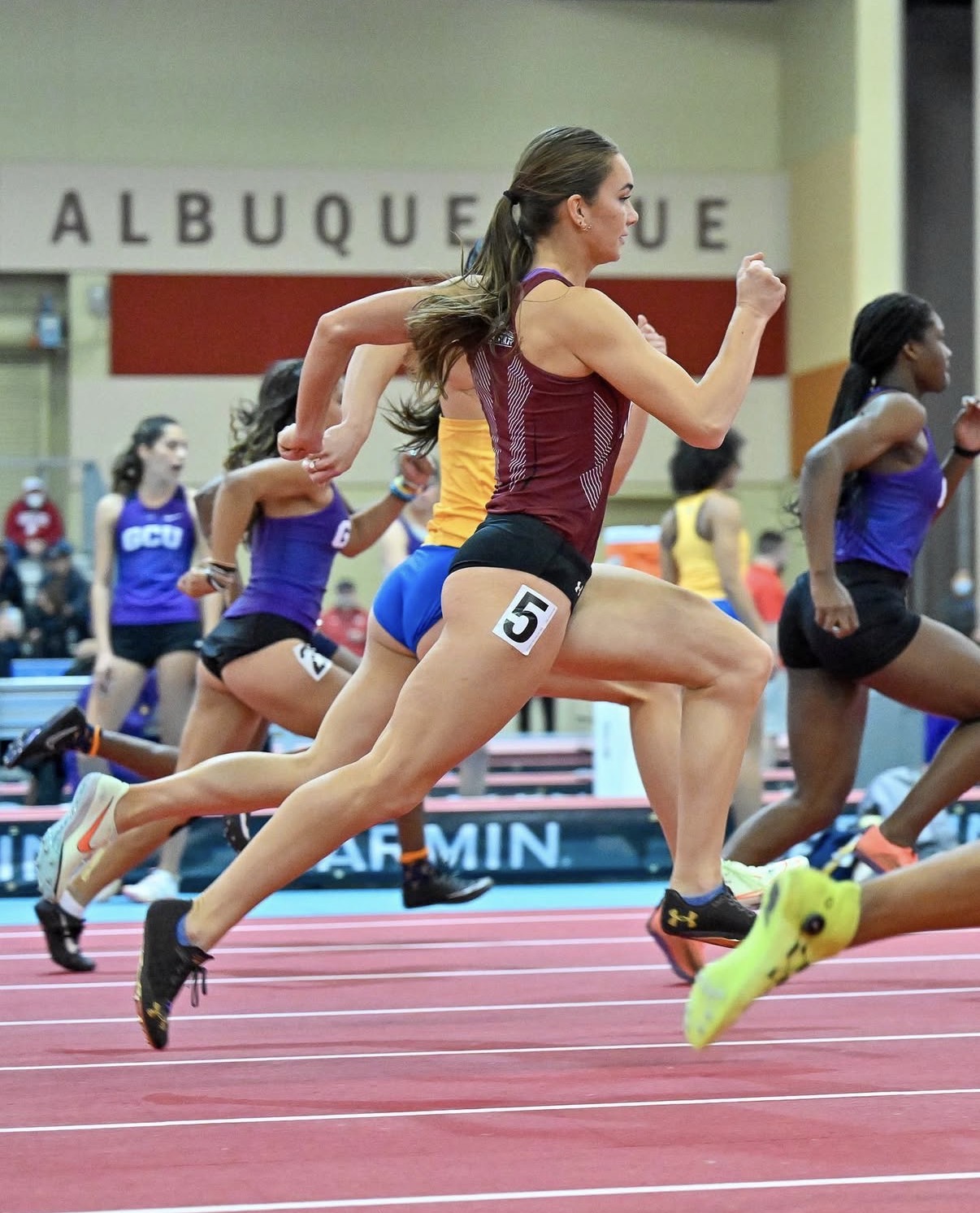 Israel sprinting in an indoor meet in Albuquerque